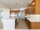 Modern kitchen with wood cabinets, quartz countertops, and stainless steel appliances at 630 N Star Ct, Apache Junction, AZ 85119
