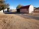 Property features a detached workshop and a spacious yard at 25645 W Blue Sky Dr, Wittmann, AZ 85361
