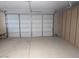 Attached garage with storage cabinets at 25645 W Blue Sky Dr, Wittmann, AZ 85361