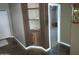 Home hallway with built-in shelves and view into another room at 25645 W Blue Sky Dr, Wittmann, AZ 85361