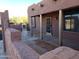 Covered patio with wooden posts and adjacent wall at 25645 W Blue Sky Dr, Wittmann, AZ 85361