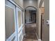 Bright hallway with access to other rooms and stained floors at 25645 W Blue Sky Dr, Wittmann, AZ 85361
