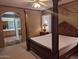 Spacious main bedroom with a large four-poster bed at 25645 W Blue Sky Dr, Wittmann, AZ 85361