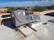 Rooftop view of an air conditioning unit, solar panels, and vent at 25645 W Blue Sky Dr, Wittmann, AZ 85361