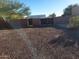 Large gravel backyard with a gated entrance at 25645 W Blue Sky Dr, Wittmann, AZ 85361