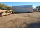 White storage container in the backyard at 25645 W Blue Sky Dr, Wittmann, AZ 85361