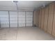 Attached garage with storage cabinets at 25645 W Blue Sky Dr, Wittmann, AZ 85361