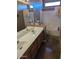 Bathroom with double vanity and bathtub at 25645 W Blue Sky Dr, Wittmann, AZ 85361