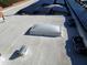 Solar panels and skylight on residential roof at 25645 W Blue Sky Dr, Wittmann, AZ 85361