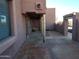 Back patio with flagstone flooring and wooden posts at 25645 W Blue Sky Dr, Wittmann, AZ 85361