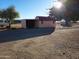 Small storage shed with a red roof at 25645 W Blue Sky Dr, Wittmann, AZ 85361