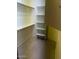 Walk-in closet with shelving and hanging rods at 25645 W Blue Sky Dr, Wittmann, AZ 85361