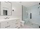 Modern bathroom with white vanity, tiled shower, and large mirror at 6512 E Hummingbird Ln, Paradise Valley, AZ 85253