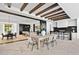 Outdoor kitchen with dark countertops and wood beams at 6512 E Hummingbird Ln, Paradise Valley, AZ 85253