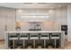 Modern kitchen features a large island with seating, marble countertops, and a statement light fixture at 28145 N 91St St, Scottsdale, AZ 85262