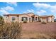 Single-story home with stucco exterior, terracotta roof, and a landscaped front yard at 31416 N 166Th Pl, Scottsdale, AZ 85262