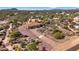 Aerial view of a single-story house with a driveway and desert landscape at 31416 N 166Th Pl, Scottsdale, AZ 85262