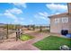 Small backyard with gravel, artificial turf, and patio furniture at 31416 N 166Th Pl, Scottsdale, AZ 85262