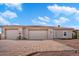 Two-car garage with paver driveway and desert landscaping at 31416 N 166Th Pl, Scottsdale, AZ 85262