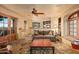 Spacious living area with stone floors, a comfortable couch, and large windows at 10040 E Happy Valley Rd # 676, Scottsdale, AZ 85255