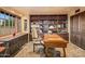 Home office with built-in bookshelves and a large work desk at 10040 E Happy Valley Rd # 676, Scottsdale, AZ 85255