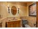 Elegant powder room with ornate sink vanity and Venetian-themed artwork at 10040 E Happy Valley Rd # 676, Scottsdale, AZ 85255