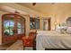 Spacious bedroom with king-size bed, access to the pool, and a sitting area at 10040 E Happy Valley Rd # 676, Scottsdale, AZ 85255