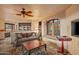 Cozy living room with a comfortable sofa and built-in bookshelves at 10040 E Happy Valley Rd # 676, Scottsdale, AZ 85255