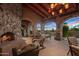 Outdoor patio with a fireplace and comfortable seating area at 10040 E Happy Valley Rd # 676, Scottsdale, AZ 85255