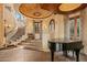 Ornate spiral staircase with wrought iron railing and stone steps at 10040 E Happy Valley Rd # 676, Scottsdale, AZ 85255