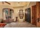 Cozy fireplace in the Primary suite with French doors and built-in cabinetry at 10040 E Happy Valley Rd # 676, Scottsdale, AZ 85255