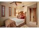 Charming bedroom with queen-size bed and wood accents at 10040 E Happy Valley Rd # 676, Scottsdale, AZ 85255