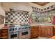 Modern kitchen with stainless steel appliances and checkered backsplash at 10040 E Happy Valley Rd # 676, Scottsdale, AZ 85255