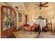 Main bedroom with king-size bed and access to a private patio at 10040 E Happy Valley Rd # 676, Scottsdale, AZ 85255