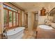 Luxurious bathroom with soaking tub, walk-in shower, and wooden vanity at 10040 E Happy Valley Rd # 676, Scottsdale, AZ 85255