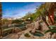 Relaxing pool and spa area with a natural rock landscape at 10040 E Happy Valley Rd # 676, Scottsdale, AZ 85255