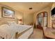 Light and airy bedroom with a comfortable bed and access to a private balcony at 10040 E Happy Valley Rd # 676, Scottsdale, AZ 85255