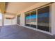 Covered back patio with sliding glass doors and view of backyard at 20240 W Catalina Dr, Buckeye, AZ 85396