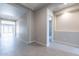 Bright hallway with tile flooring and neutral wall colors at 20240 W Catalina Dr, Buckeye, AZ 85396