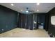 Spacious bonus room with dark walls and ceiling fan at 1069 W Elm Ave, Coolidge, AZ 85128