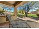 Relaxing patio with seating area and view of the green at 3105 S Amble Pass, Gold Canyon, AZ 85118