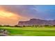 Golf course with scenic mountain views at sunset at 3105 S Amble Pass, Gold Canyon, AZ 85118