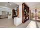 Spacious living room with built-in shelves and access to a backyard patio at 3105 S Amble Pass, Gold Canyon, AZ 85118