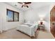 Bright bedroom with a queen-size bed and window coverings at 3105 S Amble Pass, Gold Canyon, AZ 85118
