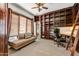 Home office with built-in shelves, desk, and comfortable seating at 3105 S Amble Pass, Gold Canyon, AZ 85118