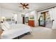 Main bedroom with king bed, access to patio, and walk-in closet at 3105 S Amble Pass, Gold Canyon, AZ 85118