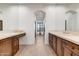 Double vanity bathroom with dark wood cabinets and tile flooring at 3105 S Amble Pass, Gold Canyon, AZ 85118