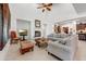 Living room boasts a cozy sectional sofa and fireplace with a large TV at 3105 S Amble Pass, Gold Canyon, AZ 85118