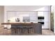 Modern kitchen with island, white cabinets, and wood countertop at 4575 N Phoenician Blvd # 1, Scottsdale, AZ 85251