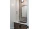 Small powder room with modern vanity and dark wood cabinets at 34749 N 83Rd Way, Scottsdale, AZ 85266